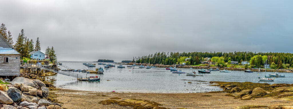 A Fleet of Maine Lobster Boats Moored in a Calm Bay on a Very Gray Cloudy Foggy Day